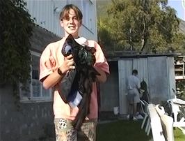 Having washed some of his clothes in a bowl and rinsed it off with a hose, Nick now has to learn how to wring it and dry it